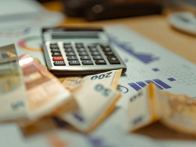 Calculator on top of euro banknotes